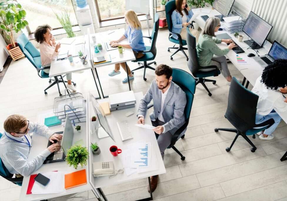 Open-plan office with diverse employees working.